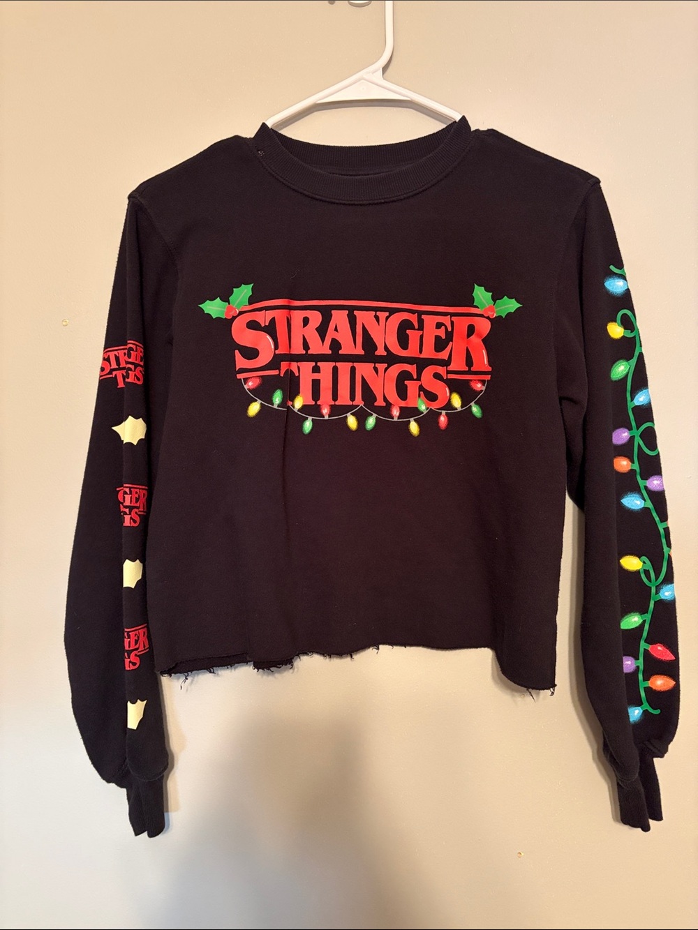 Stranger Things Black Holiday Graphic Long Sleeve Cropped Sweatshirt